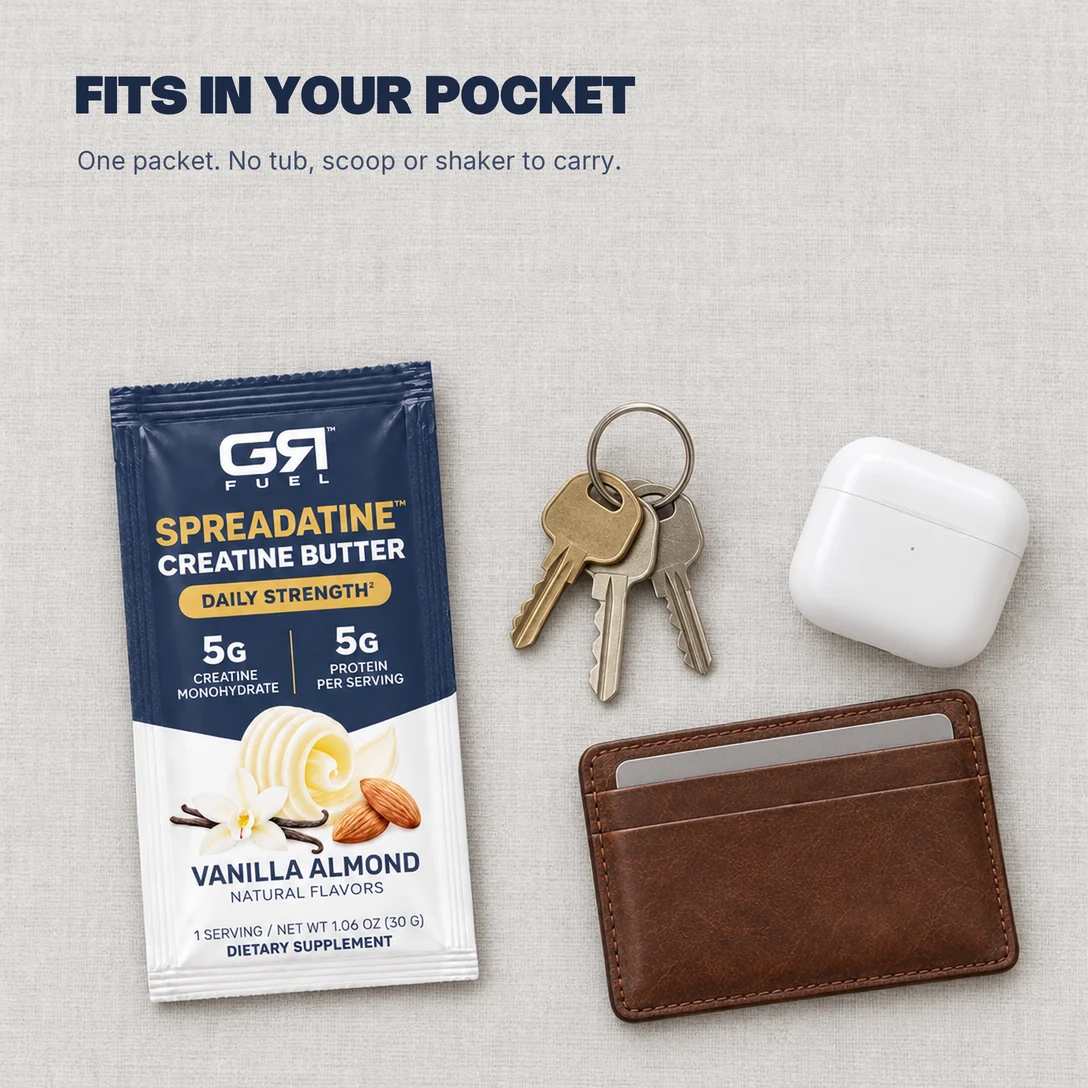 A Spreadatine packet beside keys, earbuds and a card holder: fits in your pocket