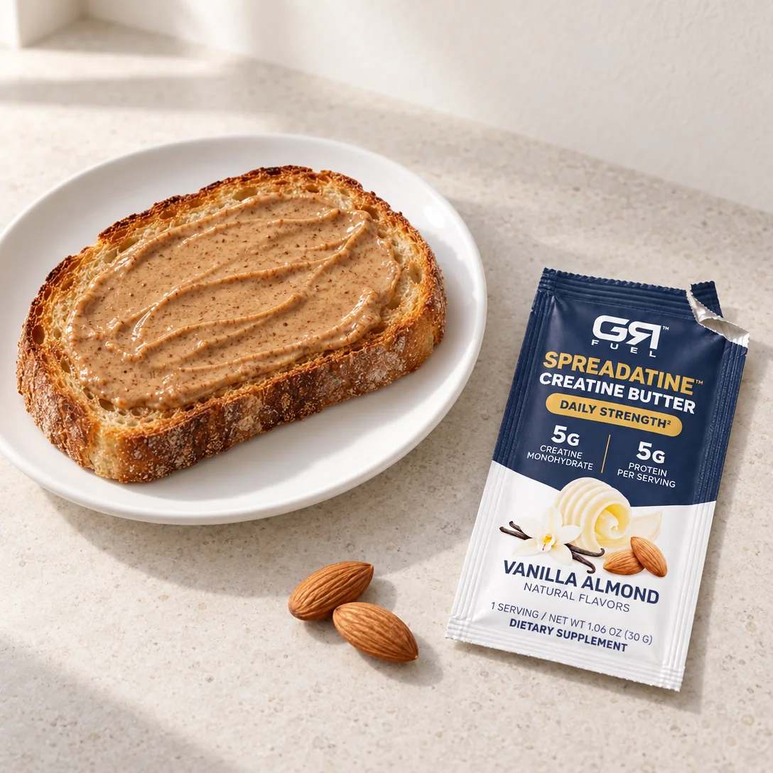 Almond butter on a slice of toast beside an open Spreadatine packet